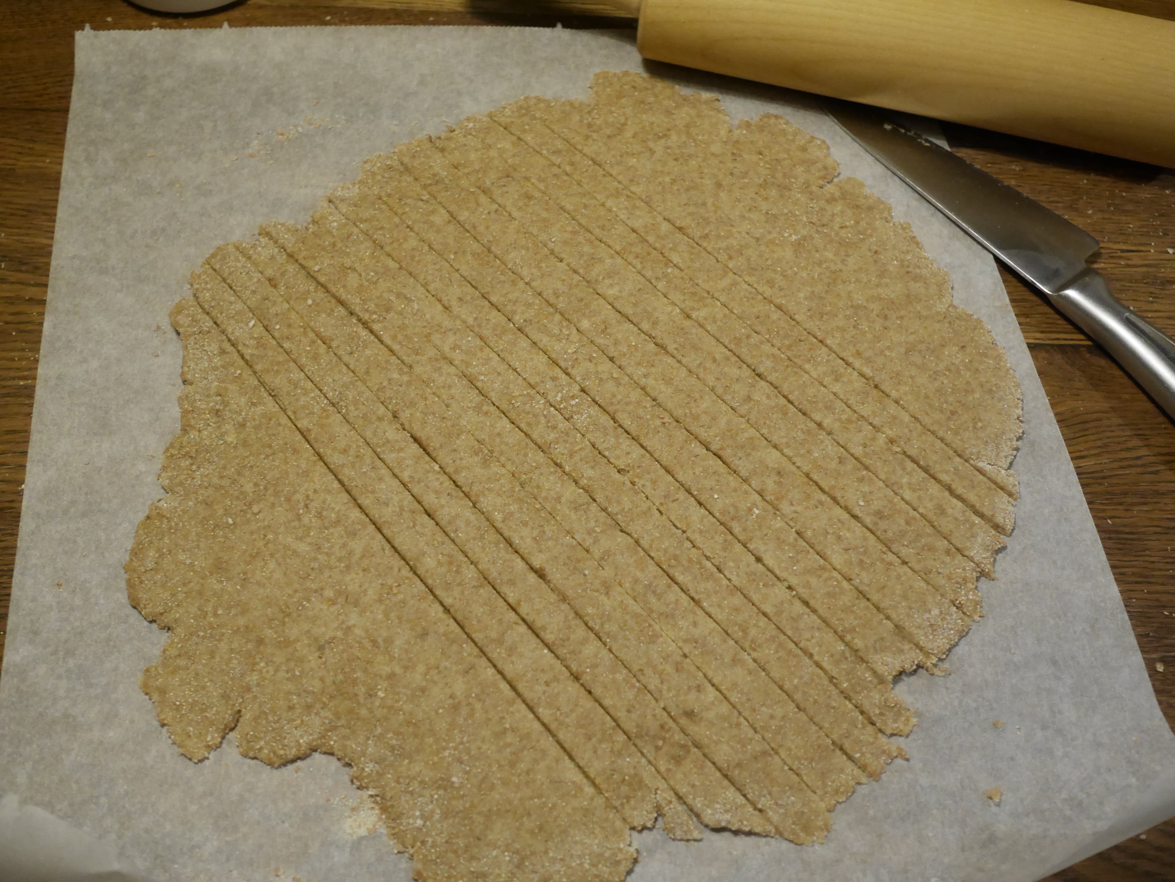 Rolled out pastry dough cut into ribbons.