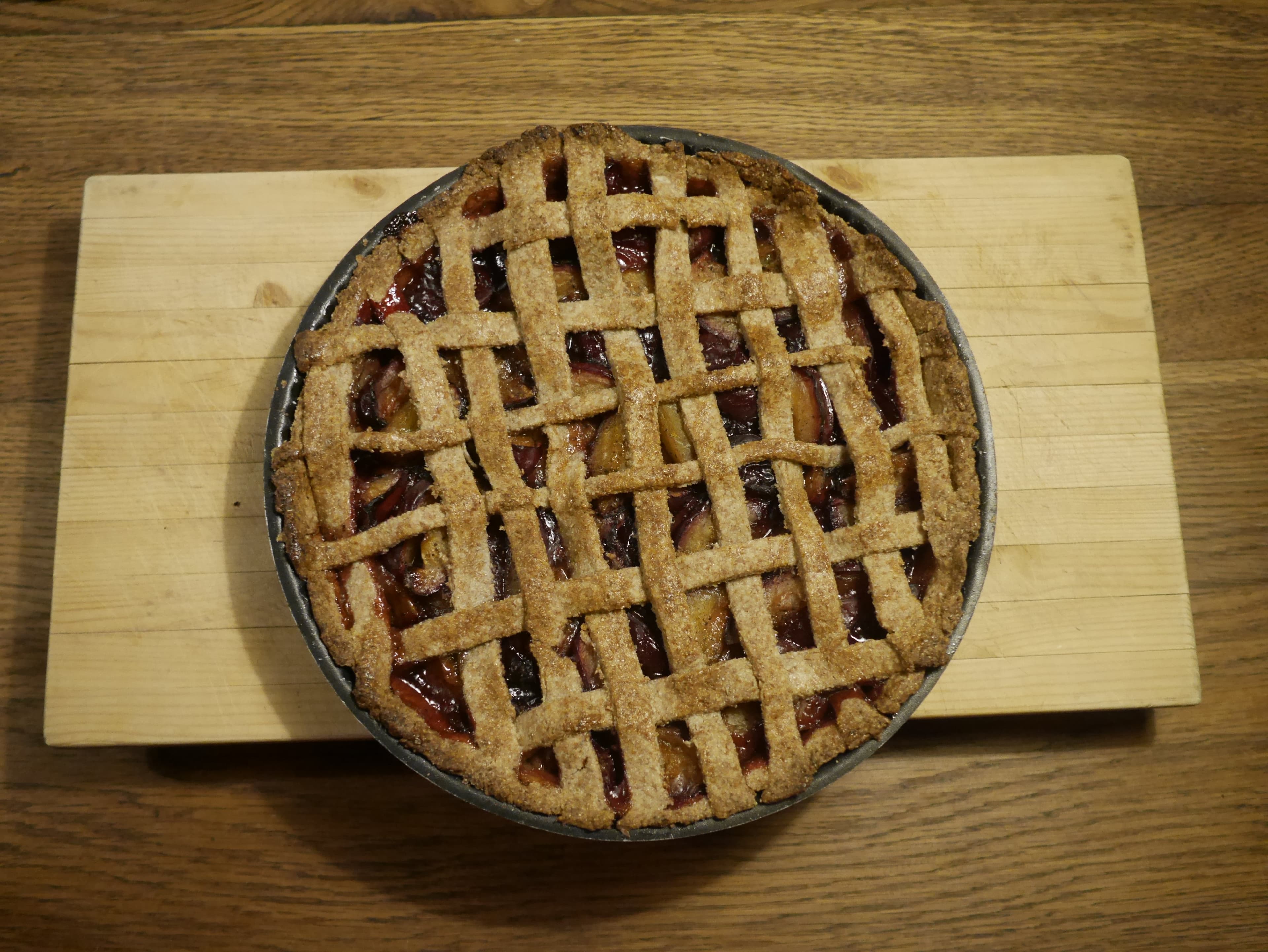 A cooked plum pie.