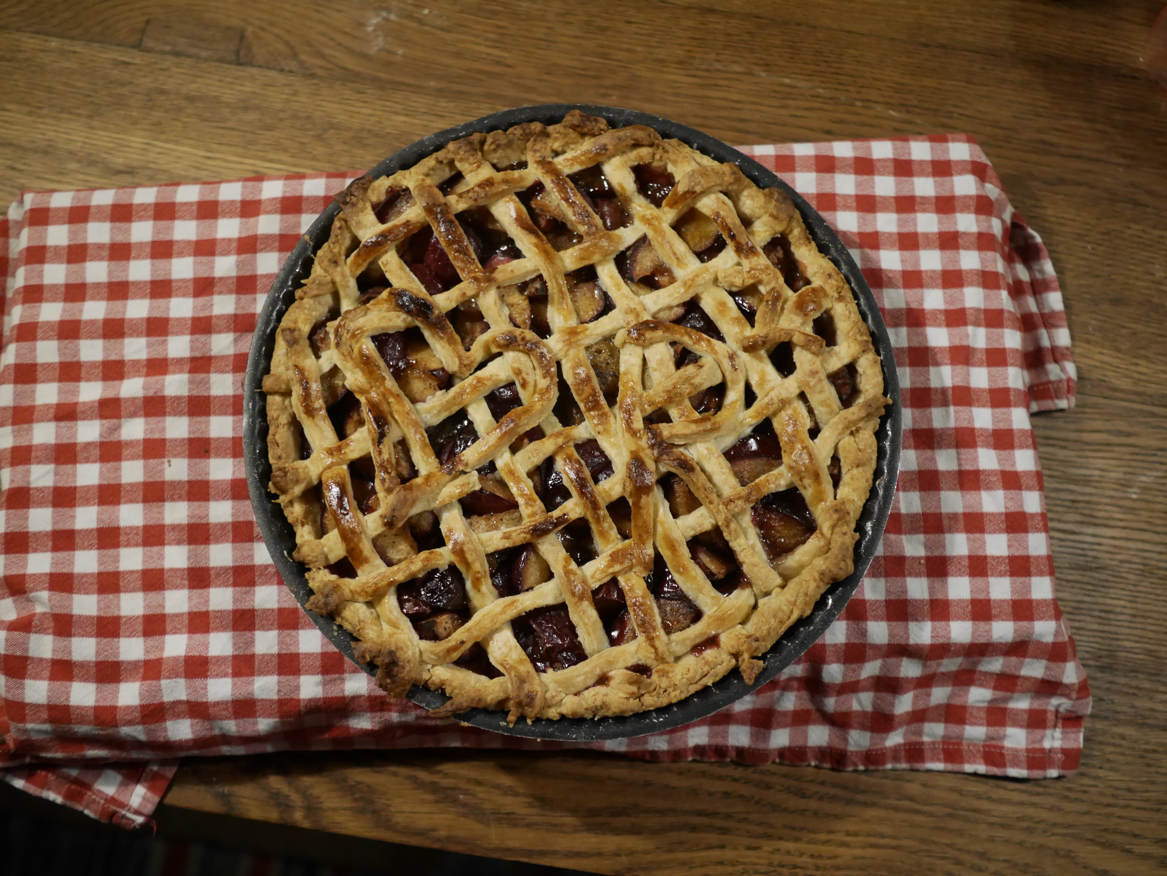 A cooked plum pie.