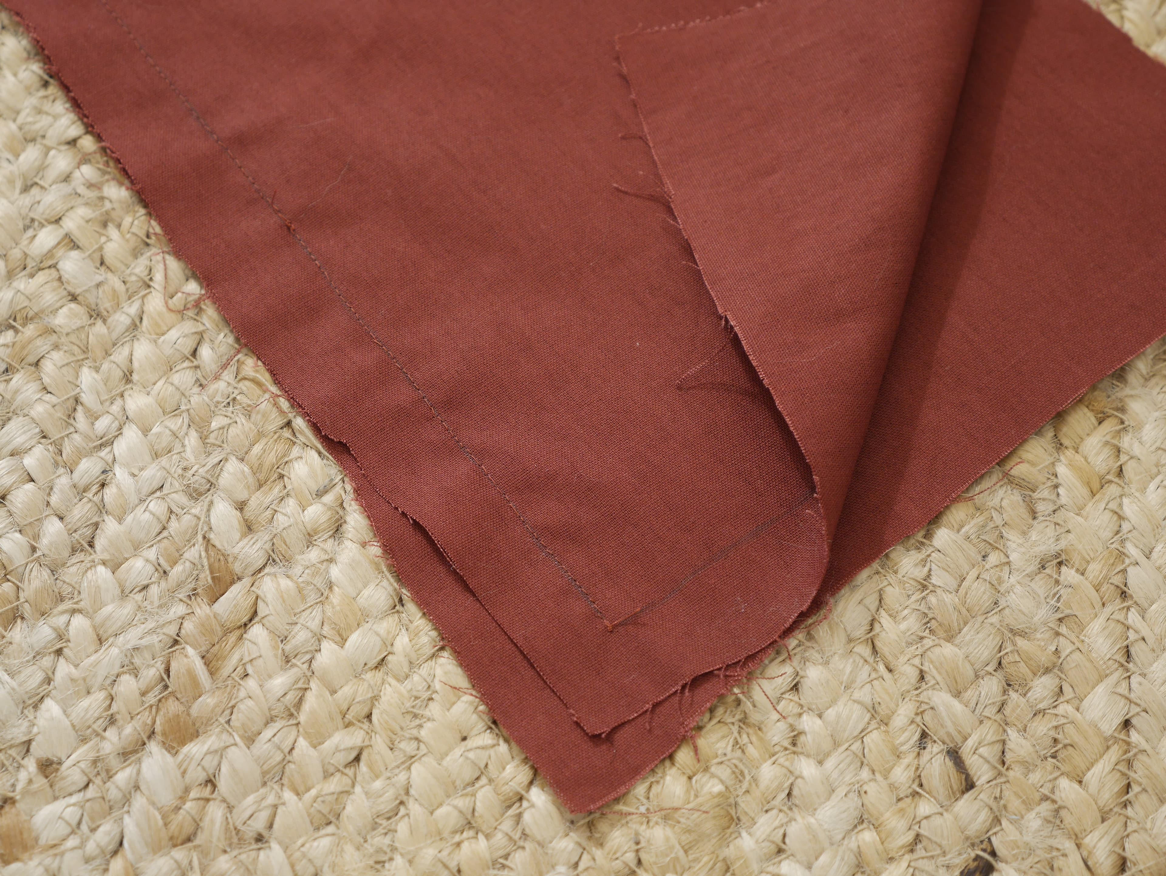A backstitch securing two skirt panels together.